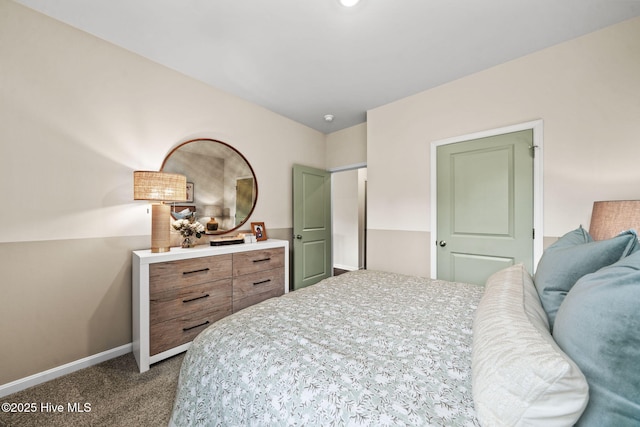 bedroom featuring baseboards and dark colored carpet