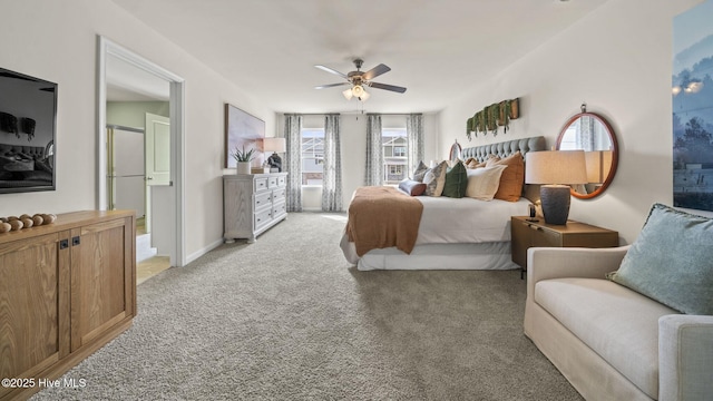 bedroom with ceiling fan and light carpet