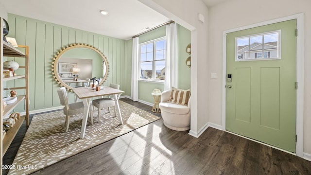 entryway with baseboards and wood finished floors