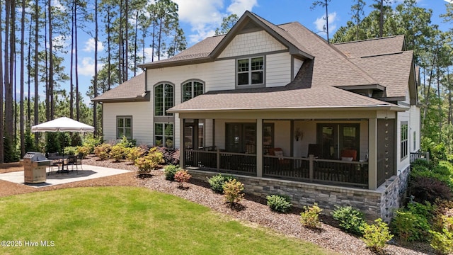 100 Holly Springs Ct, Southern Pines, NC 28387 - rear view of property with a yard, a patio area, and roof with shingles