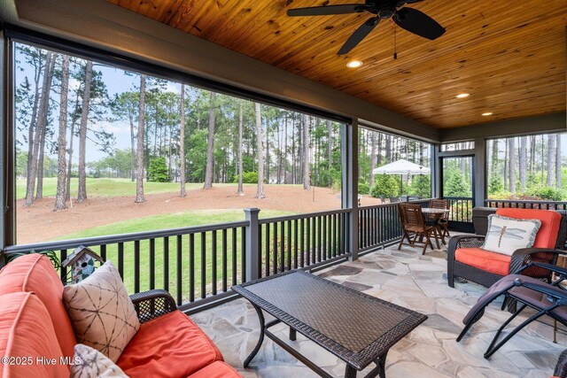 100 Holly Springs Ct, Southern Pines, NC 28387 - sunroom featuring a ceiling fan