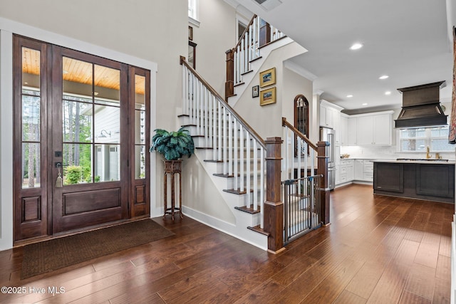 100 Holly Springs Ct, Southern Pines, NC 28387 - foyer entrance featuring crown molding, dark wood finished floors, and stairway