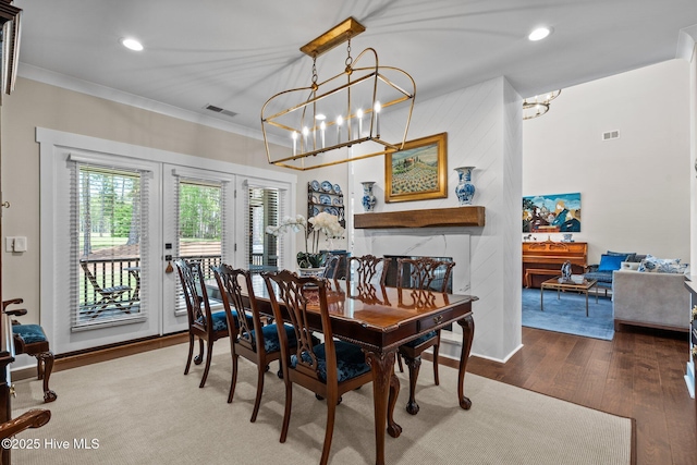 100 Holly Springs Ct, Southern Pines, NC 28387 - dining room featuring wood finished floors, french doors, a notable chandelier, ornamental molding, and recessed lighting