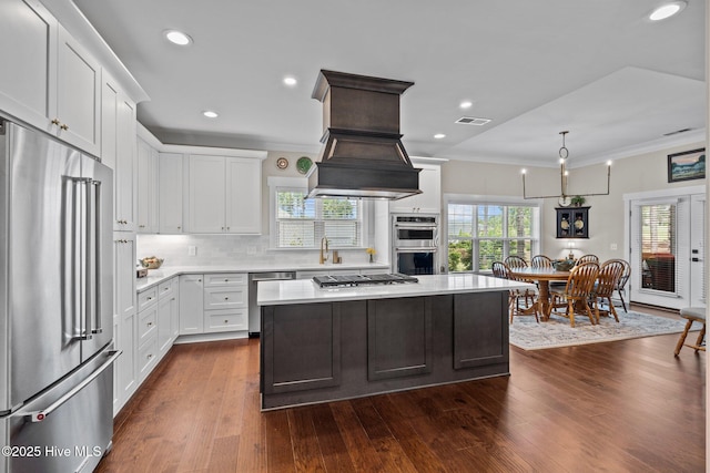 100 Holly Springs Ct, Southern Pines, NC 28387 - kitchen featuring light countertops, white cabinetry, stainless steel appliances, and visible vents