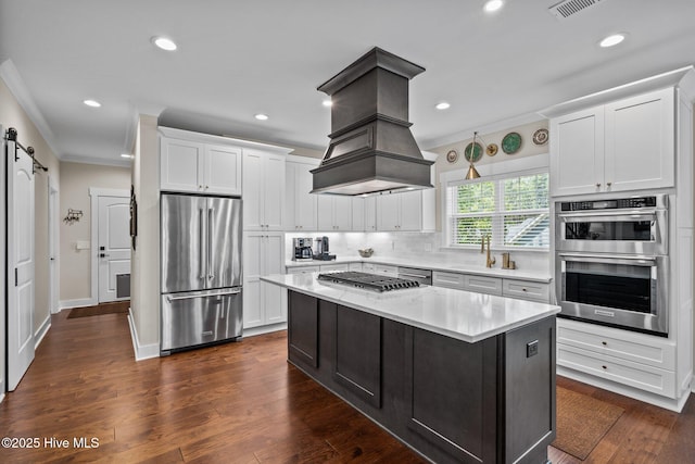 100 Holly Springs Ct, Southern Pines, NC 28387 - kitchen featuring appliances with stainless steel finishes, ornamental molding, and white cabinetry