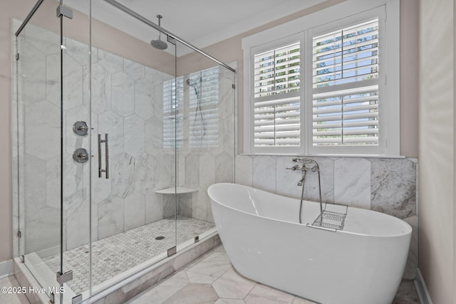 100 Holly Springs Ct, Southern Pines, NC 28387 - bathroom featuring a stall shower, marble finish floor, and a freestanding bath