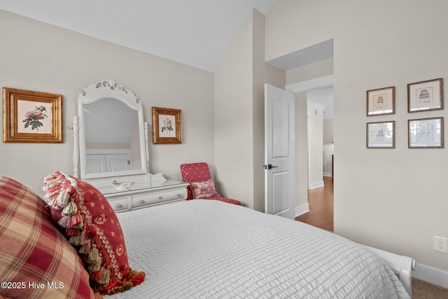 100 Holly Springs Ct, Southern Pines, NC 28387 - bedroom featuring vaulted ceiling and baseboards