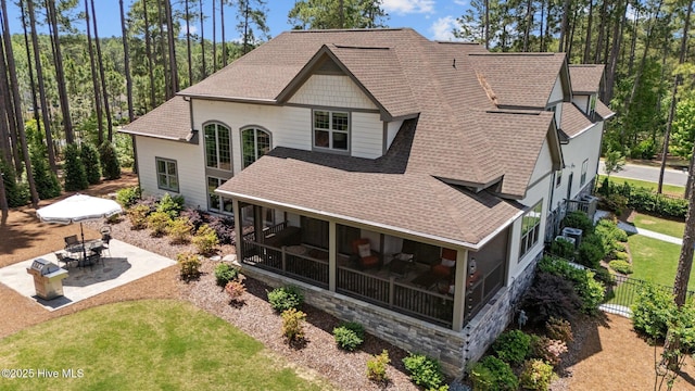 100 Holly Springs Ct, Southern Pines, NC 28387 - rear view of property with fence, a shingled roof, a patio, and a lawn