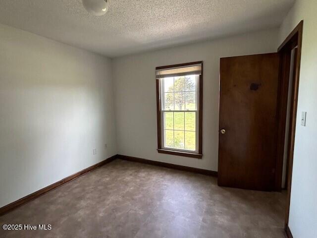 837 Simpson Ditch Rd, Elizabeth City, NC 27909 - bathroom with toilet, wood finished floors, and a textured ceiling