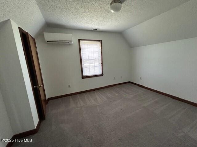 837 Simpson Ditch Rd, Elizabeth City, NC 27909 - bonus room with lofted ceiling, carpet flooring, and a wall mounted AC