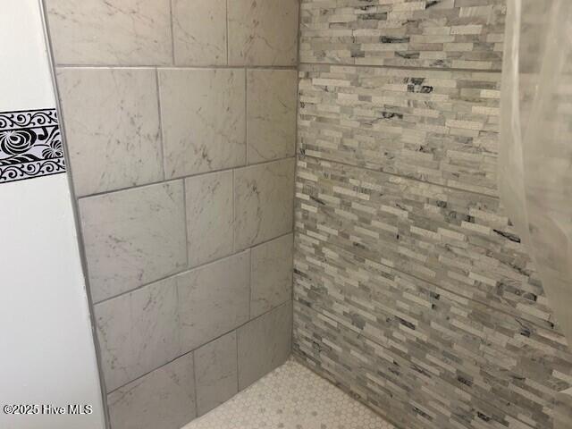 837 Simpson Ditch Rd, Elizabeth City, NC 27909 - laundry area with water heater, washer and dryer, and cabinet space