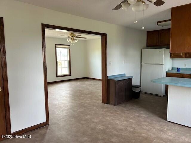 837 Simpson Ditch Rd, Elizabeth City, NC 27909 - unfurnished bedroom with baseboards, a wall mounted AC, and concrete flooring