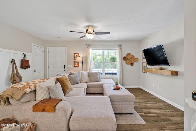 197 Cherry Rd, Southport, NC 28461 - living room featuring a ceiling fan, dark wood-style flooring, and baseboards