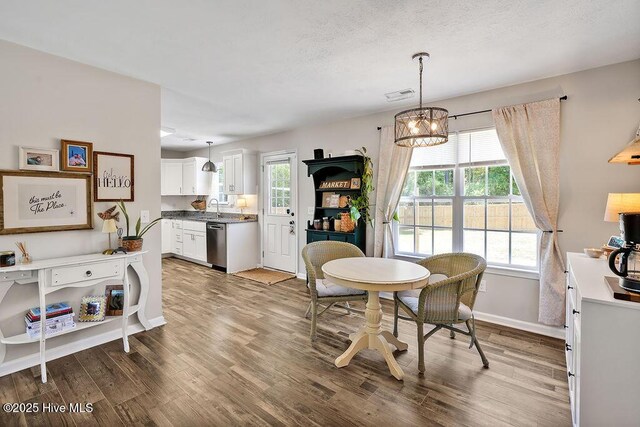 197 Cherry Rd, Southport, NC 28461 - dining area featuring wood finished floors, healthy amount of natural light, and baseboards