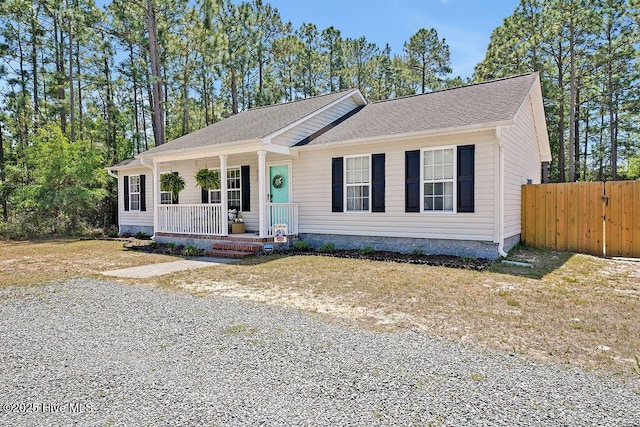 197 Cherry Rd, Southport, NC 28461 - view of front of property with a porch, fence, and a shingled roof