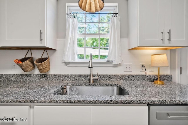 197 Cherry Rd, Southport, NC 28461 - kitchen featuring a sink, white cabinets, decorative backsplash, and plenty of natural light