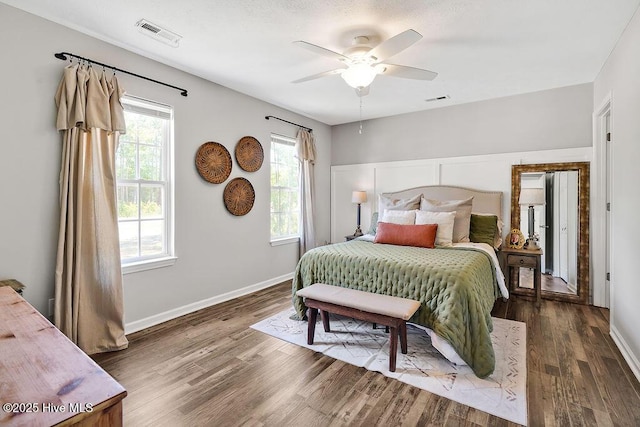 197 Cherry Rd, Southport, NC 28461 - bedroom featuring multiple windows, wood finished floors, and baseboards