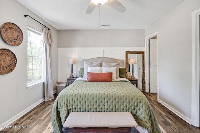 197 Cherry Rd, Southport, NC 28461 - bedroom with multiple windows, wood finished floors, and baseboards