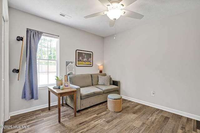 197 Cherry Rd, Southport, NC 28461 - living room featuring wood finished floors, ceiling fan, and baseboards