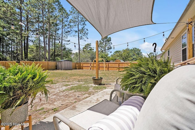 197 Cherry Rd, Southport, NC 28461 - fenced backyard with a patio, a shed, and an outbuilding
