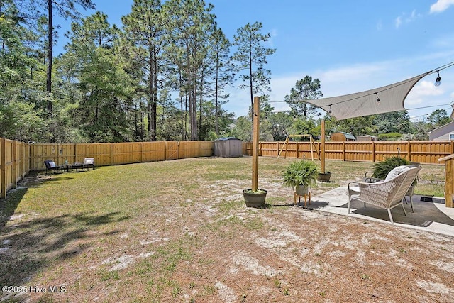 197 Cherry Rd, Southport, NC 28461 - view of yard with a storage shed, a patio area, and an outdoor structure