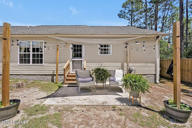 197 Cherry Rd, Southport, NC 28461 - back of property featuring fence, entry steps, a patio, and roof with shingles