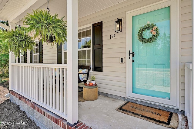 197 Cherry Rd, Southport, NC 28461 - view of exterior entry featuring a porch