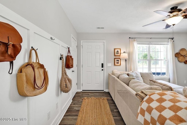 197 Cherry Rd, Southport, NC 28461 - foyer featuring dark wood-style flooring, a ceiling fan, and baseboards