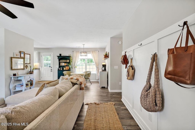 197 Cherry Rd, Southport, NC 28461 - living room with dark wood-style floors, a ceiling fan, and baseboards