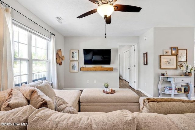 197 Cherry Rd, Southport, NC 28461 - living room with baseboards, a ceiling fan, and wood finished floors