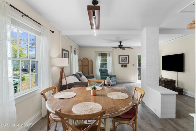 dining room with wood finished floors, ceiling fan, beamed ceiling, and baseboards