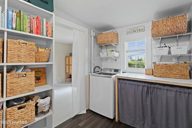 laundry room with dark wood-style flooring, laundry area, and washer / clothes dryer