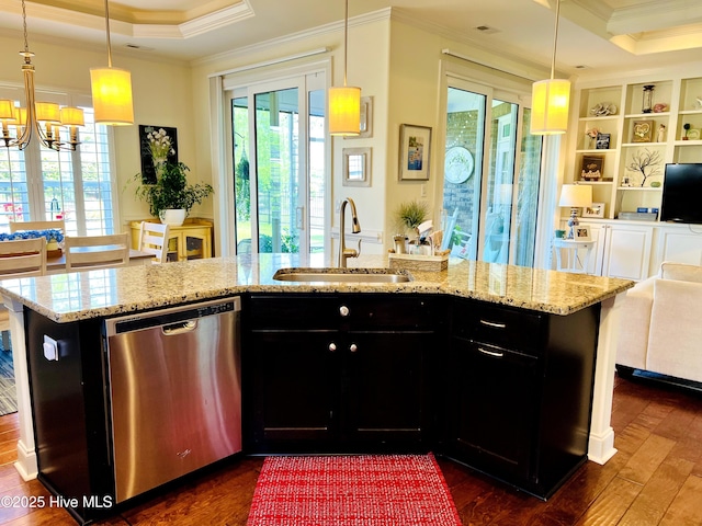 2208 Drawing Ct, Wilmington, NC 28412 - kitchen featuring stainless steel dishwasher, a raised ceiling, dark cabinets, ornamental molding, and open floor plan