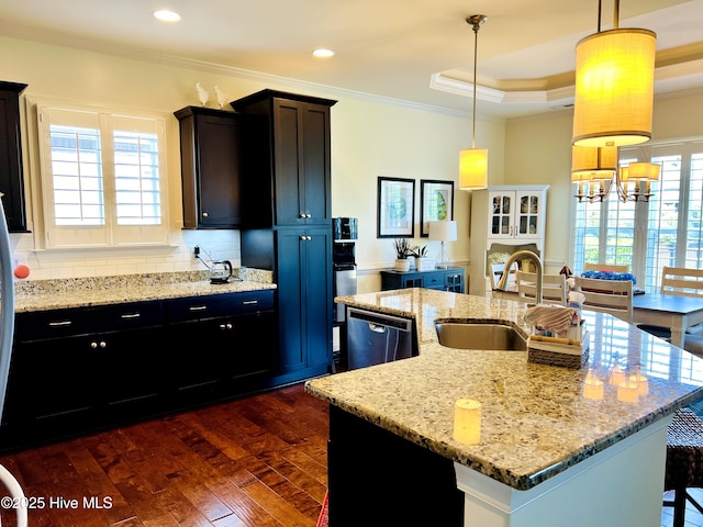 2208 Drawing Ct, Wilmington, NC 28412 - kitchen with crown molding, stainless steel dishwasher, dark wood-type flooring, tasteful backsplash, and a kitchen island with sink