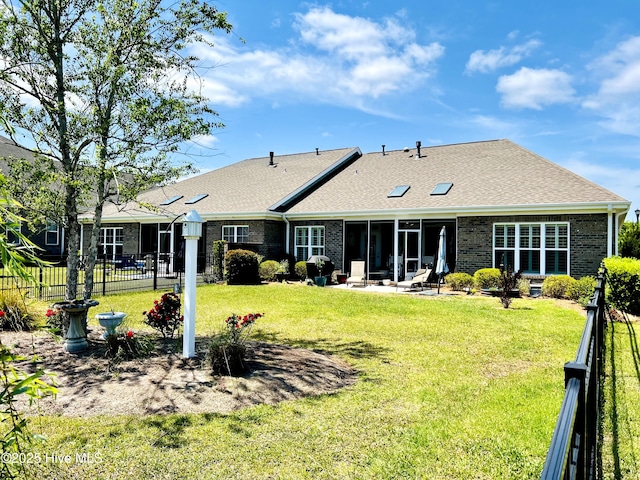 2208 Drawing Ct, Wilmington, NC 28412 - back of property featuring a sunroom, brick siding, and roof with shingles