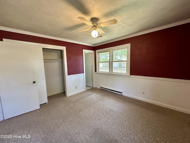 119 Emperor Landing Rd, Edenton, NC 27932 - unfurnished bedroom with carpet flooring, a closet, ceiling fan, crown molding, and a baseboard radiator