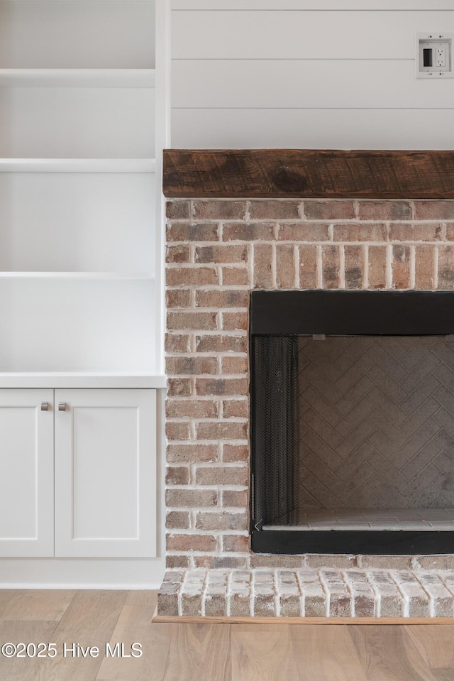 room details featuring a brick fireplace