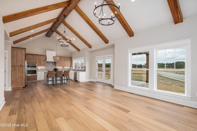 living room with recessed lighting, an inviting chandelier, light wood-type flooring, beam ceiling, and high vaulted ceiling