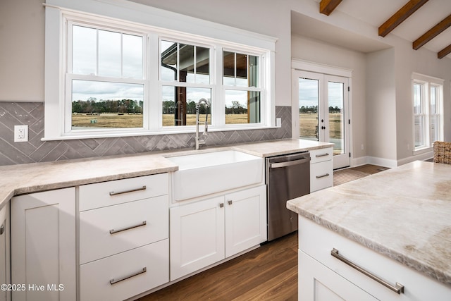 kitchen with dishwasher, a sink, beam ceiling, tasteful backsplash, and dark wood-style flooring
