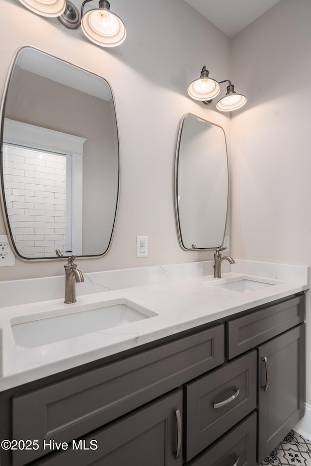 bathroom featuring a sink and double vanity