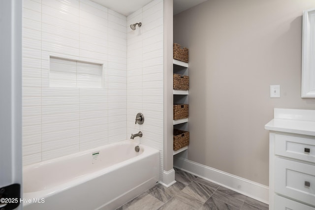 full bathroom featuring shower / bathing tub combination, baseboards, and vanity