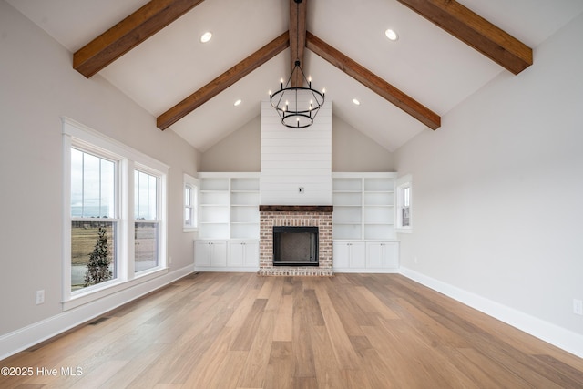 unfurnished living room with beam ceiling, light wood-style flooring, visible vents, and an inviting chandelier