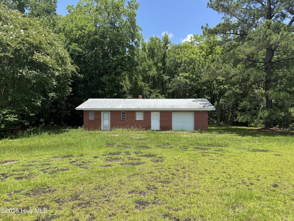 11085 Sam Potts Hwy, Lake Waccamaw, NC 28450 - view of outbuilding with a forest view