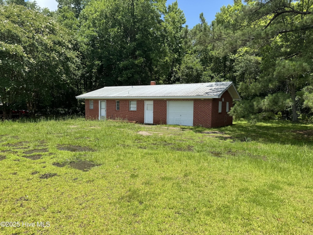 11085 Sam Potts Hwy, Lake Waccamaw, NC 28450 - view of outbuilding with a wooded view
