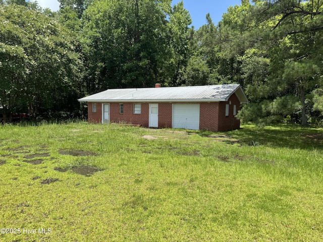 11085 Sam Potts Hwy, Lake Waccamaw, NC 28450 - view of outbuilding with a wooded view