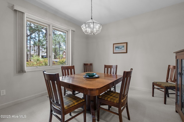 8 Driving Range Rd, Pinehurst, NC 28374 - dining room with light carpet, a chandelier, and baseboards