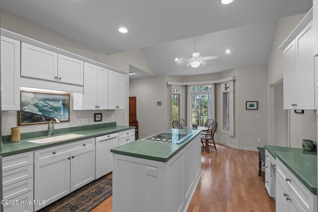 8 Driving Range Rd, Pinehurst, NC 28374 - kitchen featuring a sink, dishwasher, dark countertops, wood finished floors, and black electric cooktop