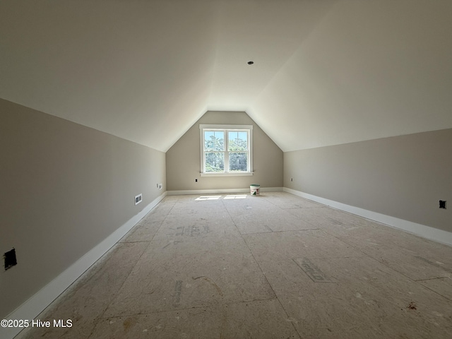 125 Tee Dr, Selma, NC 27576 - additional living space with lofted ceiling and baseboards