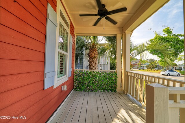 6445 Figure Eight Dr SW, Ocean Isle Beach, NC 28469 - deck with a ceiling fan and a porch