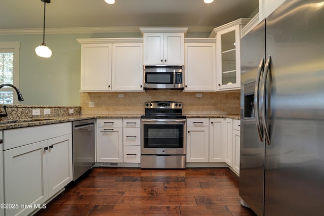 6445 Figure Eight Dr SW, Ocean Isle Beach, NC 28469 - kitchen featuring stainless steel appliances, a sink, ornamental molding, white cabinetry, and glass insert cabinets